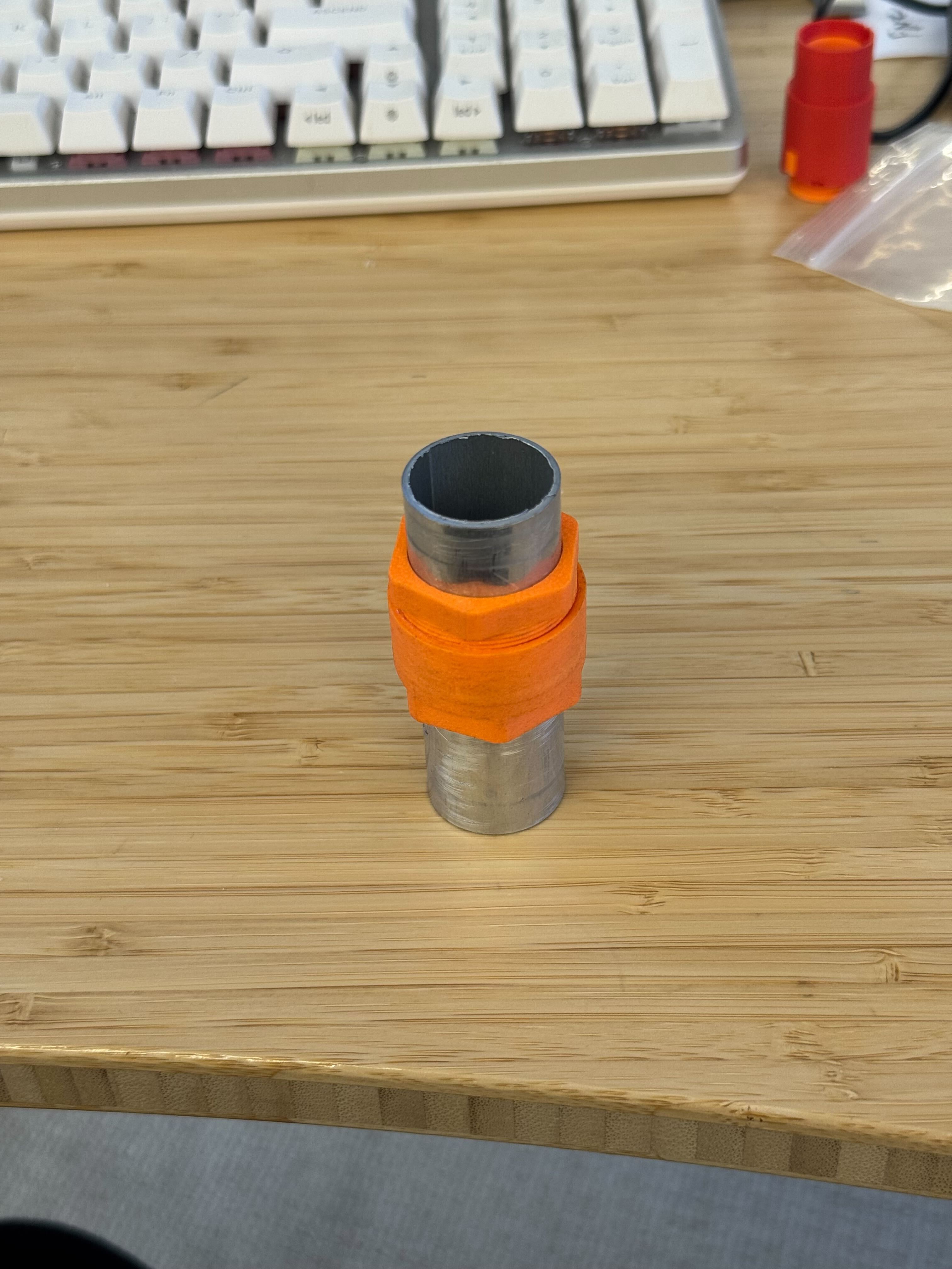 FDM printed prototype clamped on an aluminum tube