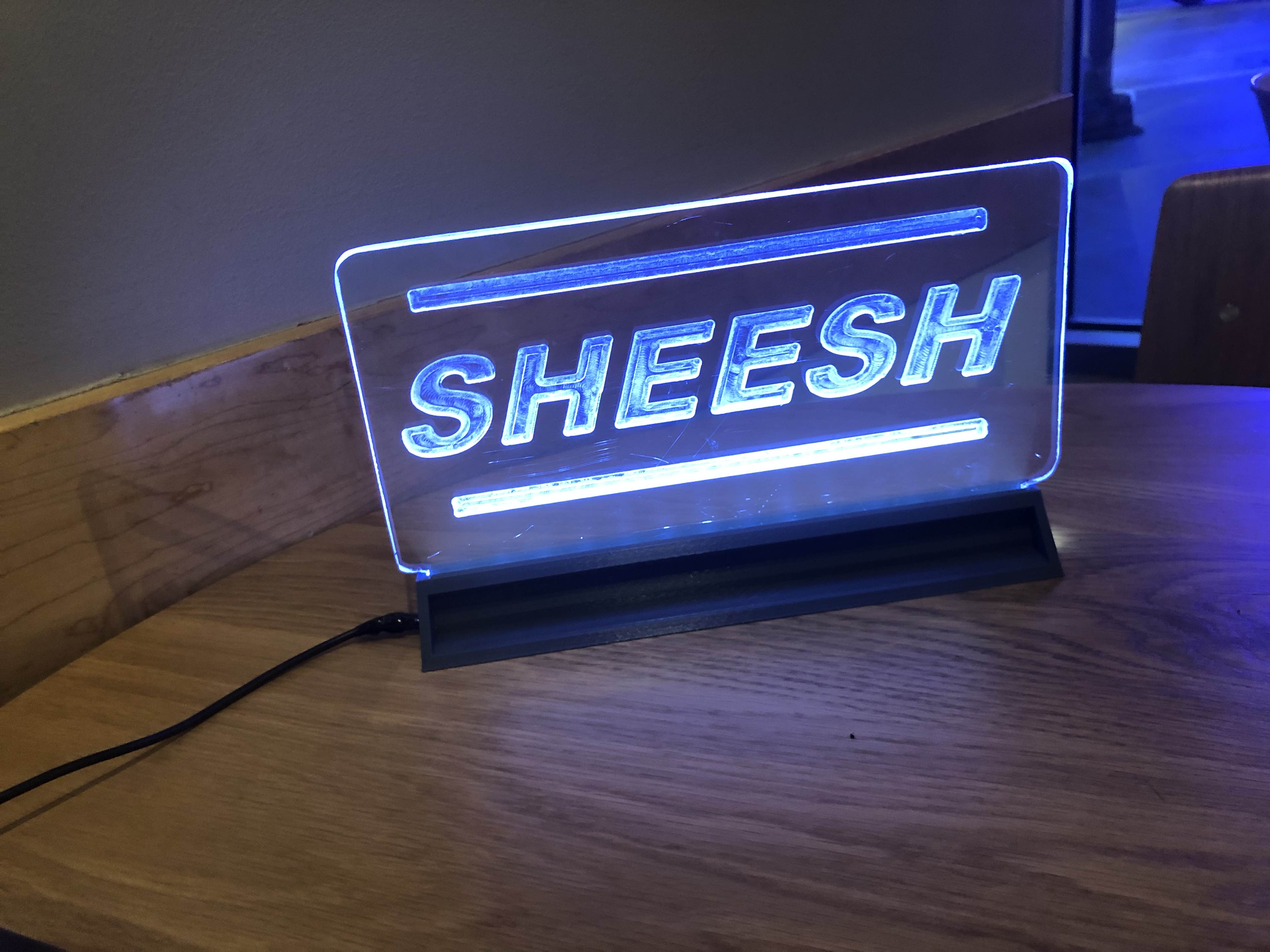 SHEESH sign stand